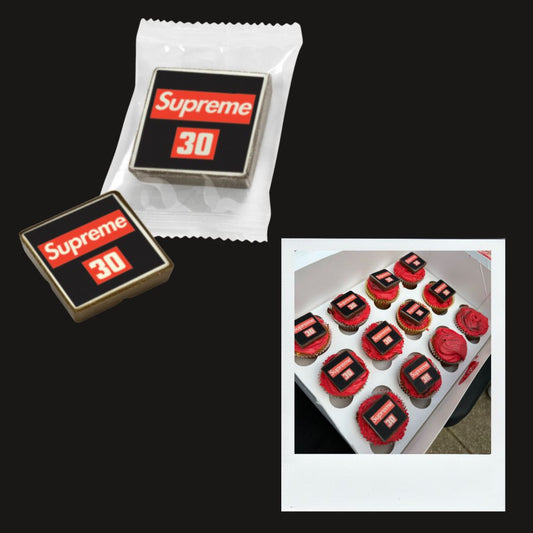 A DOZEN CUPCAKES WITH PRINTED CHOCOLATE SQUARES